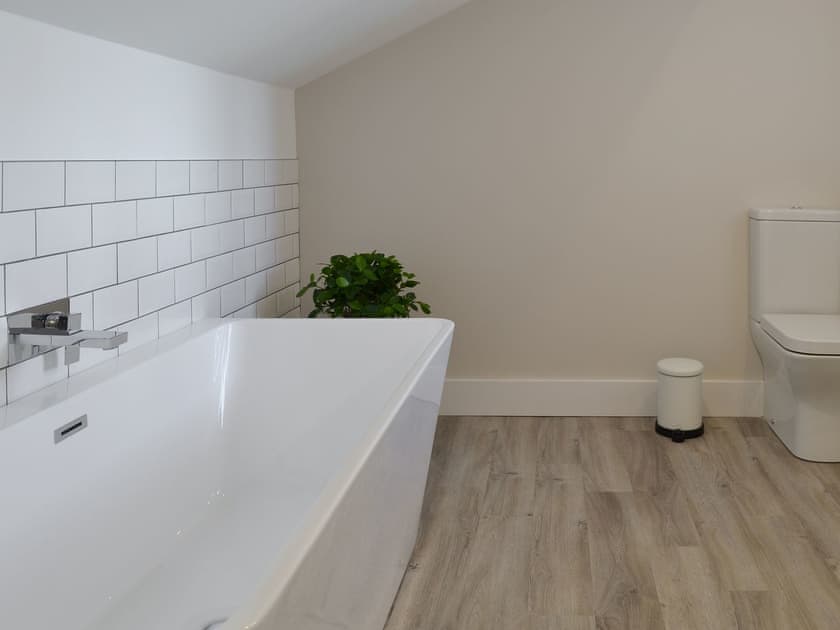 House bathroom features a bath and separate shower cubicle | The Station House - Station House Cottages, Upper Poppleton, near York