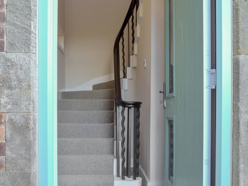 Stunning sweeping staircase with wrought iron balustrade | The Station House - Station House Cottages, Upper Poppleton, near York