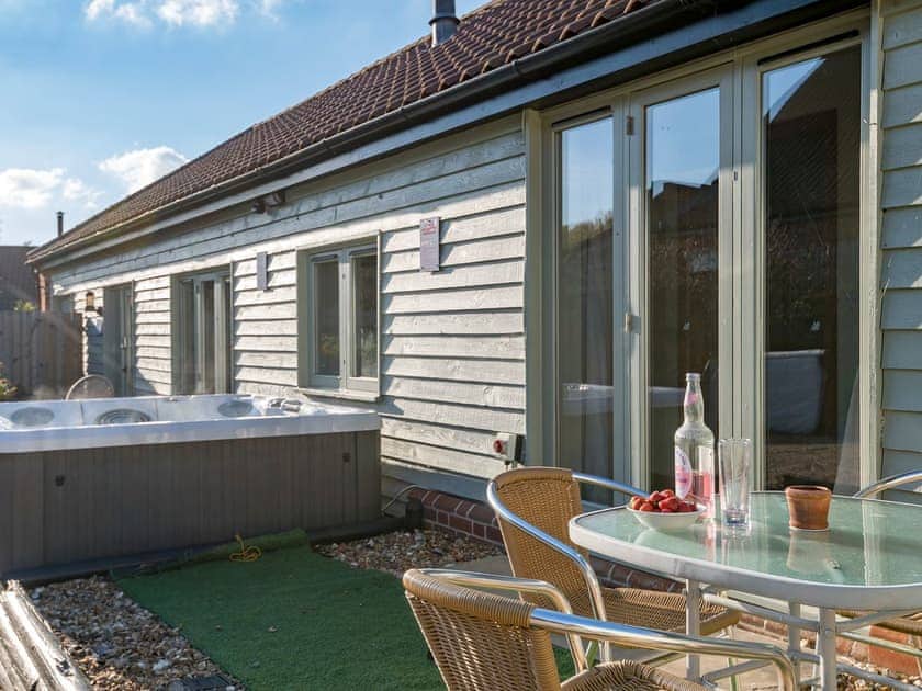 Courtyard with sitting-out area, garden furniture and bbq | The Milking Parlour - Manor Mews, Tattersett, near Fakenham
