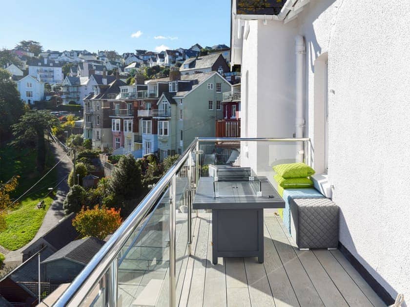 Decked balcony has an outdoor sofa and dining table | Apartment 3, Charborough House, Salcombe