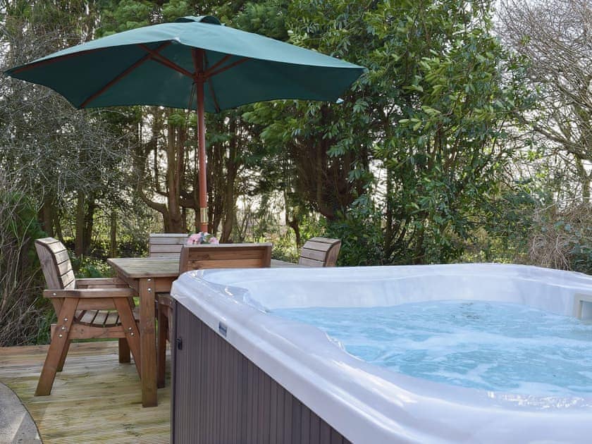 Secluded private hot tub and table and chairs | Greenacres, Reynalton, near Tenby