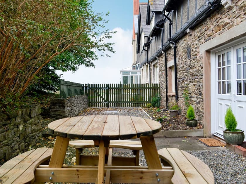  Paved and gravelled courtyard with sitting-out area and garden furniture | The East Wing at Grove Hall, Bodfari, near Denbigh