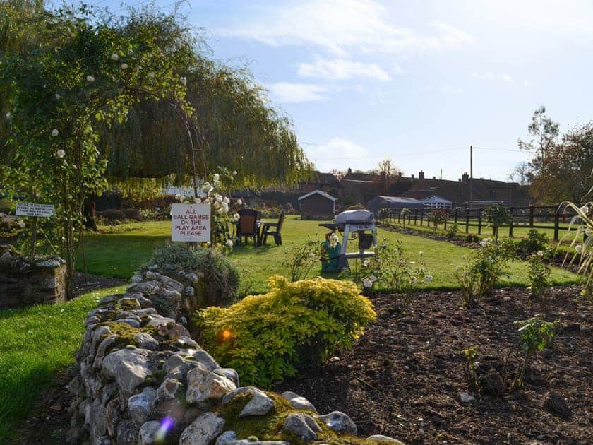 Shared garden seating area | Moor Farm Stable Cottages, Foxley, near Fakenham