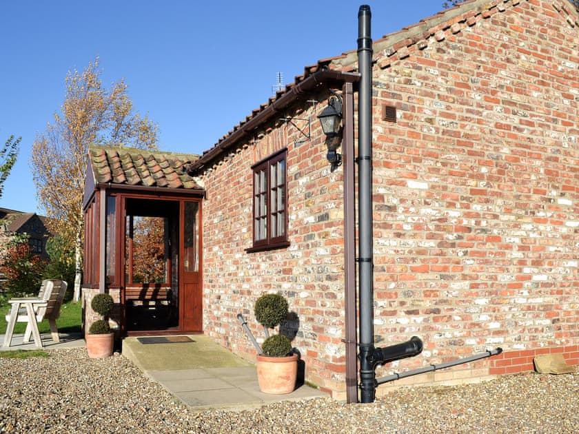Wonderful cottage with paved patio area in which to soak up the sun | The Old Chapel, Hempholme, near Brandesburton