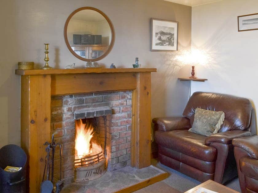 Welcoming living room with open fire | 3 Breckery, Staffin, Isle of Skye
