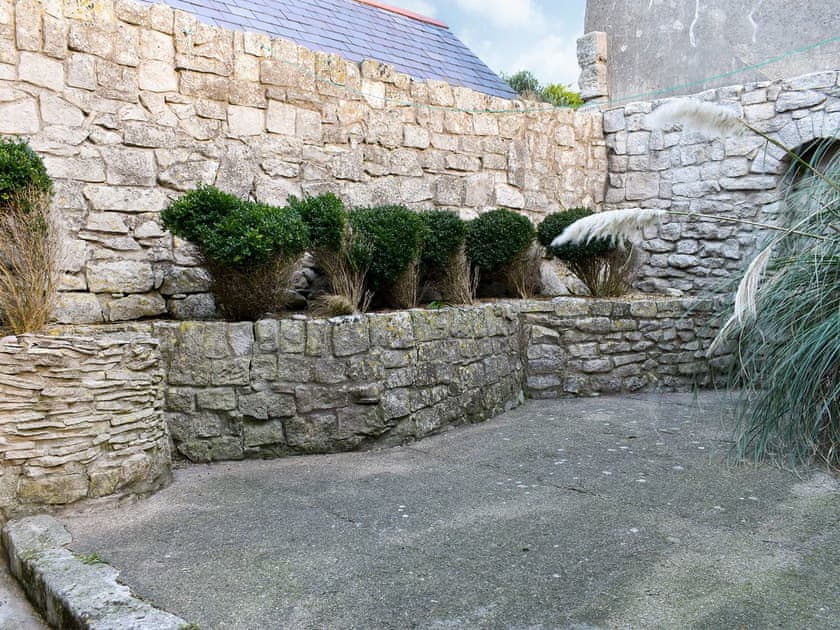 Courtyard with garden furniture | Pebbles, Portland