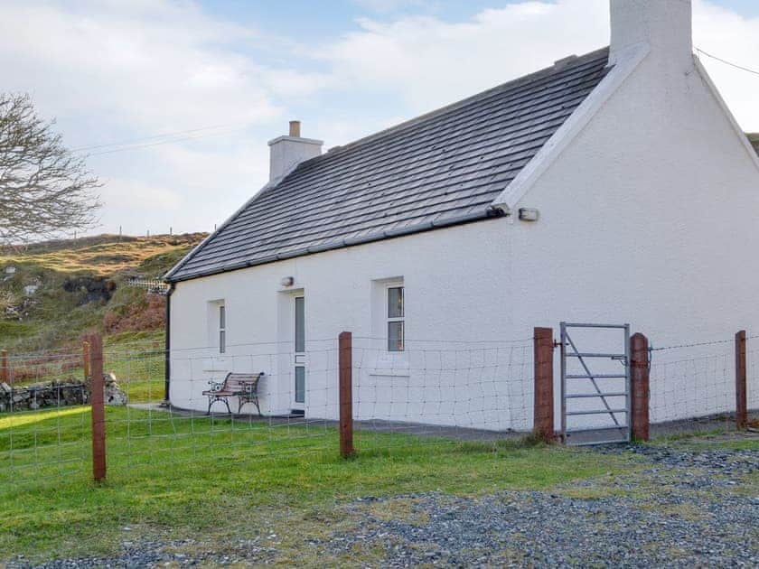 Parking area at side of cottage | Waterfall Cottage, Glendale, Isle of Skye