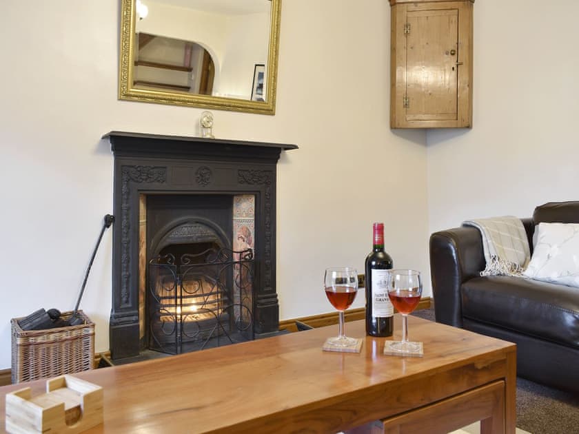 Feature fireplace within living room | Slater’s Cottage, Middleham, near Leyburn