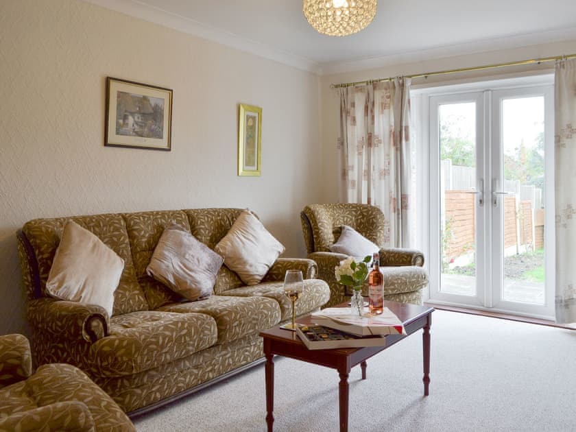 Spacious living room with French doors to garden | The Warren, Whitstable