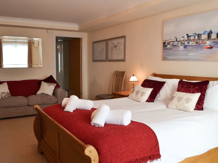 Spacious double bedroom with French doors leading to Juliet balcony | Sunsets@Spinnakers, Newquay