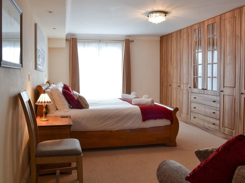 Spacious double bedroom with French doors leading to Juliet balcony | Sunsets@Spinnakers, Newquay