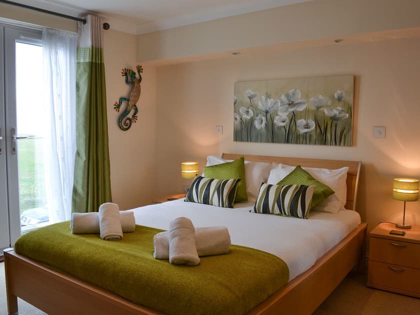 Double bedroom with French doors leading to Juliet balcony | Sunsets@Spinnakers, Newquay