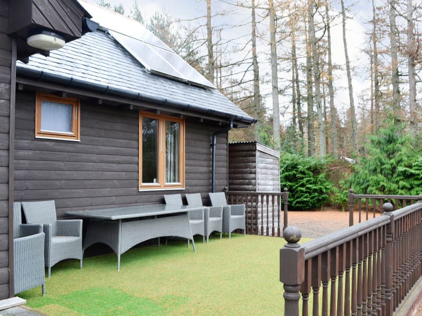 Astroturfed patio area with furniture | Park Lodge - Birchland, Strachan, near Banchory