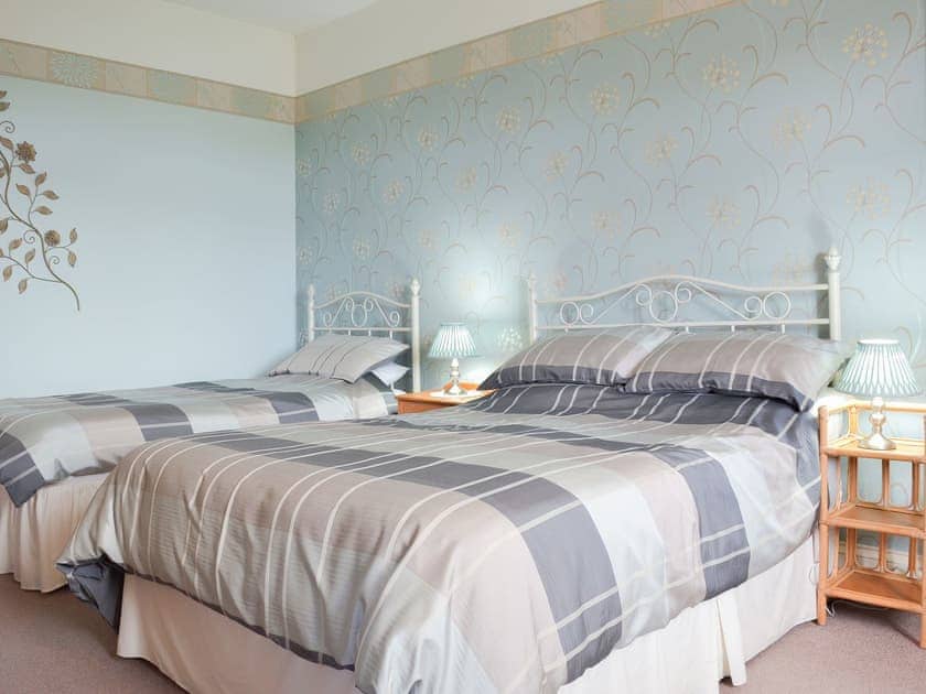 Comfortable bedroom with double and single beds | Court Place, Porlock