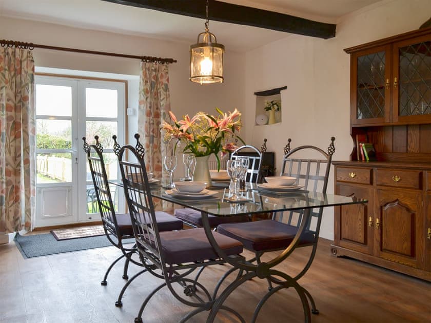 Cosy dining area with electric wood burner | Hopedene Cottage, Weare, near Axbridge