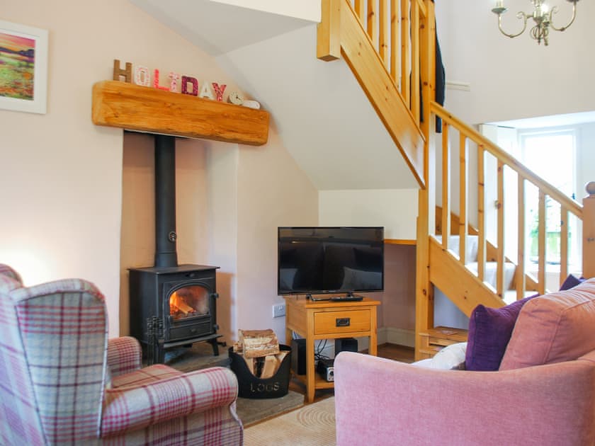 Cosy living room with wood burner and Smart TV  | School Cottage, Newbiggin-in-Bishopdale, near Leyburn