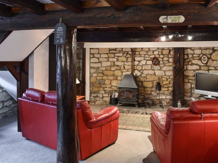 Living room with wood burner | Poppy Cottage - Sands Farm Cottages, Wilton near Pickering