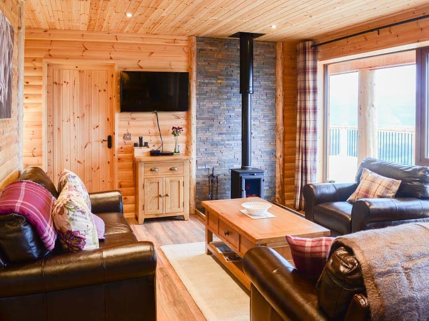 Warm and cosy living area with fantastic views | Red Kite Lodge,Osprey Lodge, near Dornoch