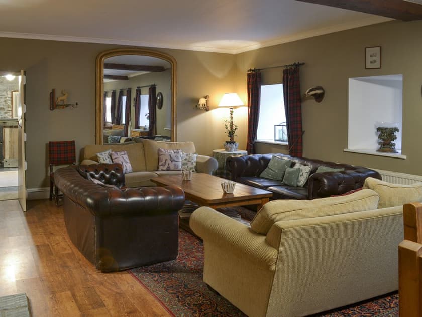 Cosy lounge area | The Shooting Lodge, Colquite, Washaway