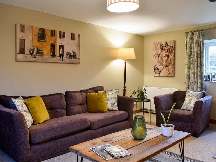 Cosy and warm living room with open fire | Barters Cottage, North Chideock, near Bridport
