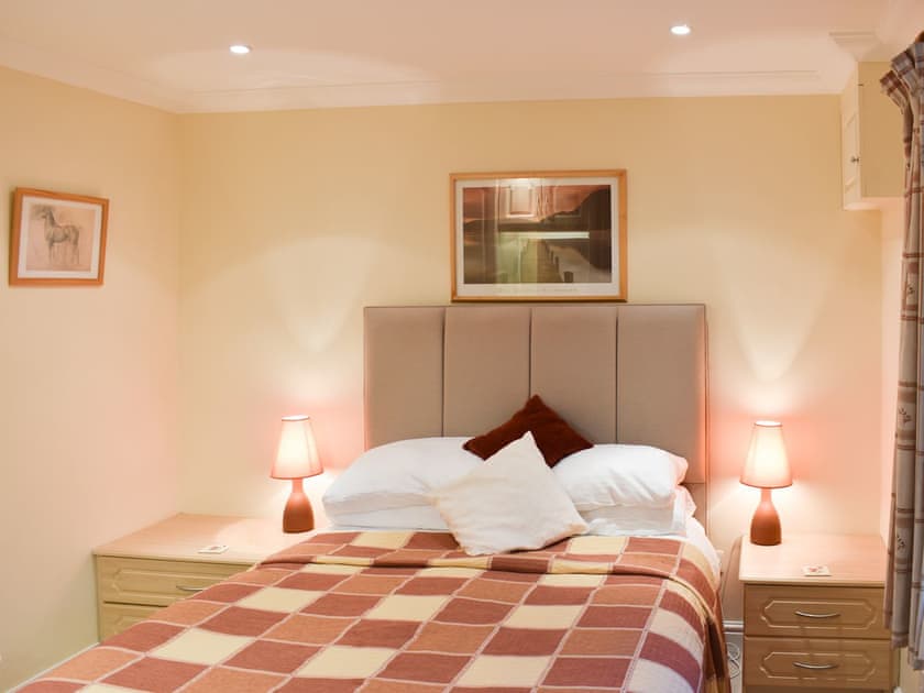 Welcoming double bedroom with en-suite | Woodside Cottage, Ecclerigg, near Ambleside