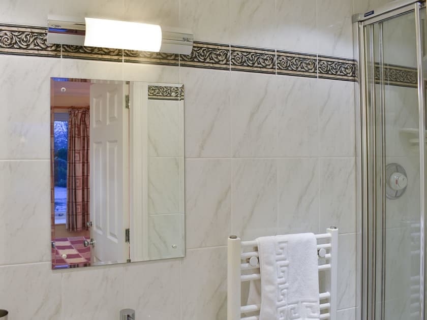 Practical en-suite shower room | Woodside Cottage, Ecclerigg, near Ambleside