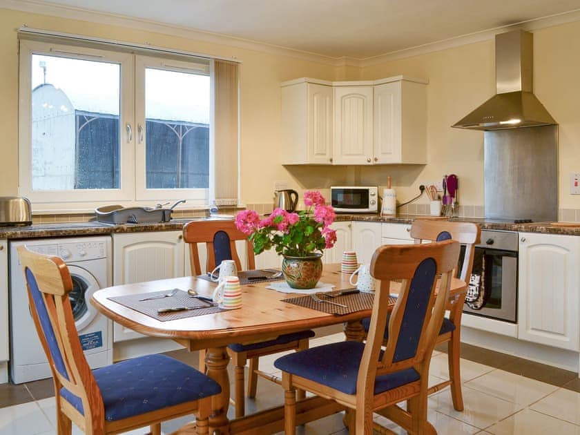 Well-equipped fitted kitchen with dining area | Sylvan Cottage - Rousland Cottages, Linlithgow