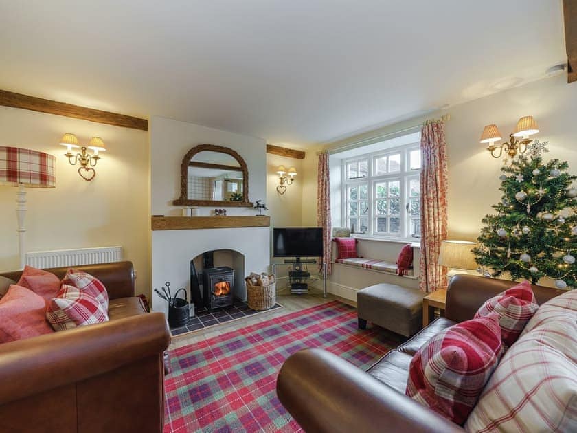 Cosy living room with wood burner | Jasmine Cottage, Bourton-on-the-Water