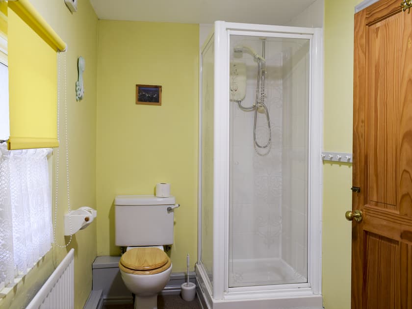 Bathroom with w.c, bath, separate shower, handbasin, electric towel rail  | Flither Cottage, Staithes, near Saltburn-by-the-Sea