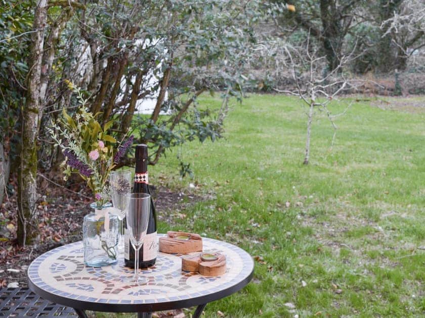 Lovely views over the mature garden from the patio | Treen, Lansallos, near Looe