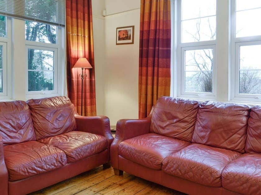 Comfy seating within living room | Kirkennan Lodge, Palnackie, Castle Douglas