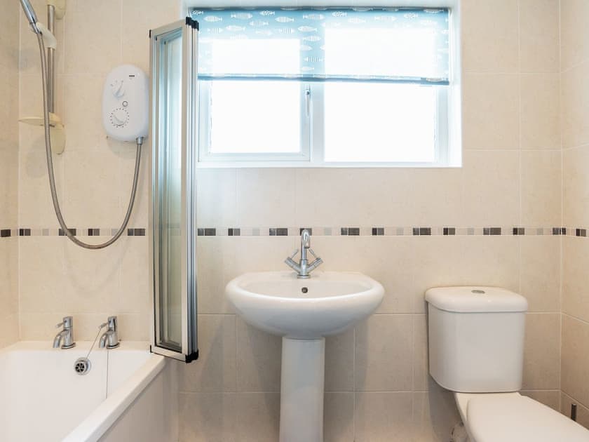 Bathroom with shower over the bath | 9 Dolphin Court, Brixham