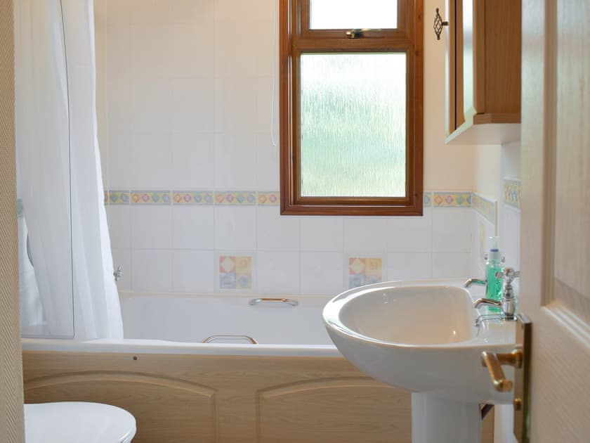 Family bathroom with shower over bath | Colman Brook Lodge, Corton, near Lowestoft