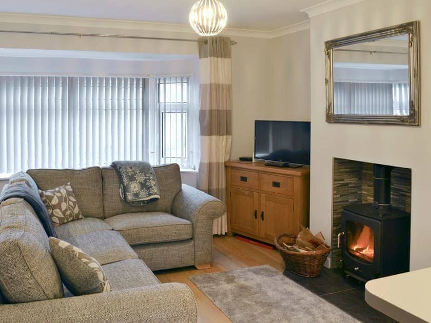 Charming living area with wood burner | Hafod y Bryn, Benllech, near Llangefni