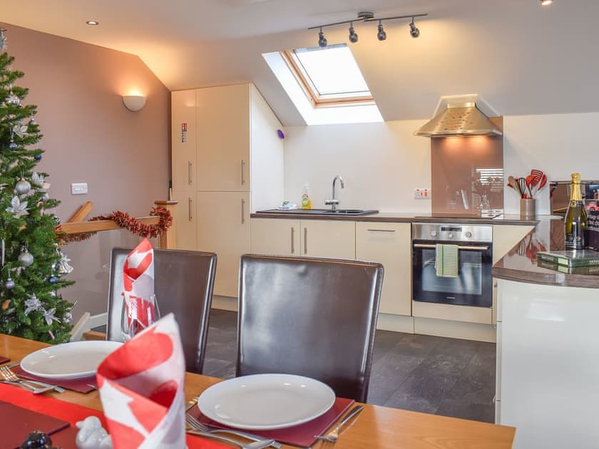 Dining room through to the kitchen area | The Plucking Barn, Llanwnnen, near Lampeter