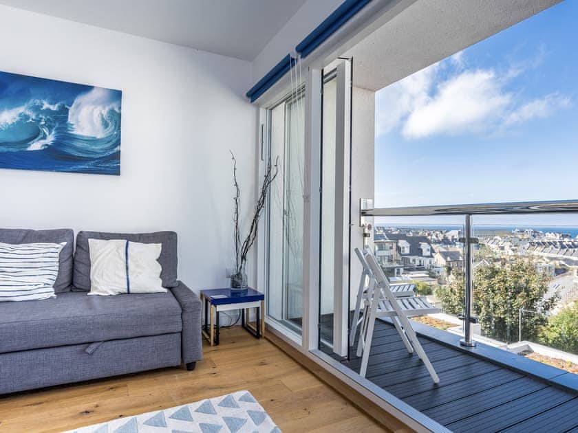 Comfortable living area with access to the balcony | Above Towan @ 8 Quay Court, Newquay