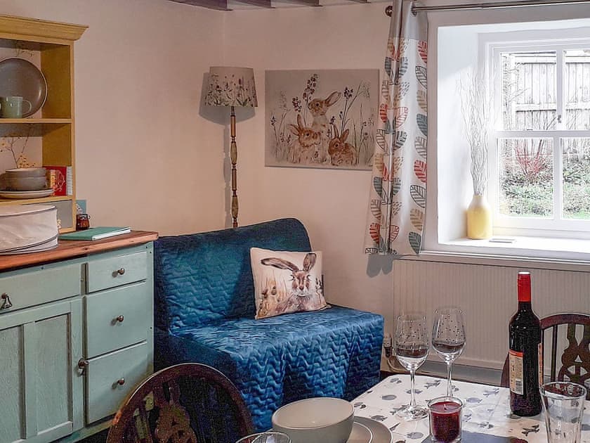 Dining room view into enclosed garden | Woodlands Cottage, Hook, near Haverfordwest