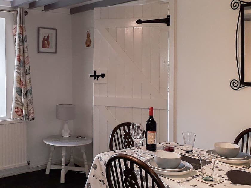 Lovely beamed dining room | Woodlands Cottage, Hook, near Haverfordwest