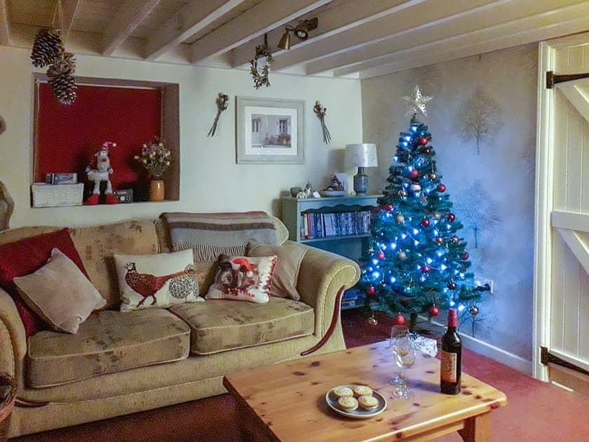 Living room with seasonal decor | Woodlands Cottage, Hook, near Haverfordwest