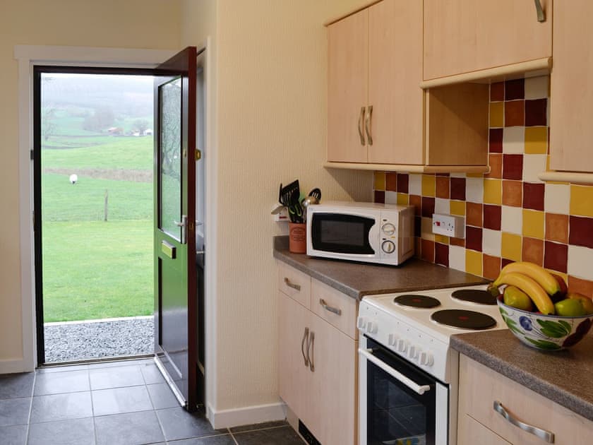 Fully appointed kitchen with access to garden | Beuchan Bungalow - Beuchan Farm, Keir Mill, Thornhill