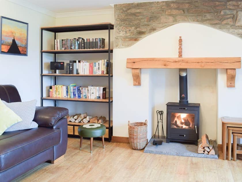 Cosy living room with wood burner | Castle Hill Cottage, Llansteffan, near Carmarthen