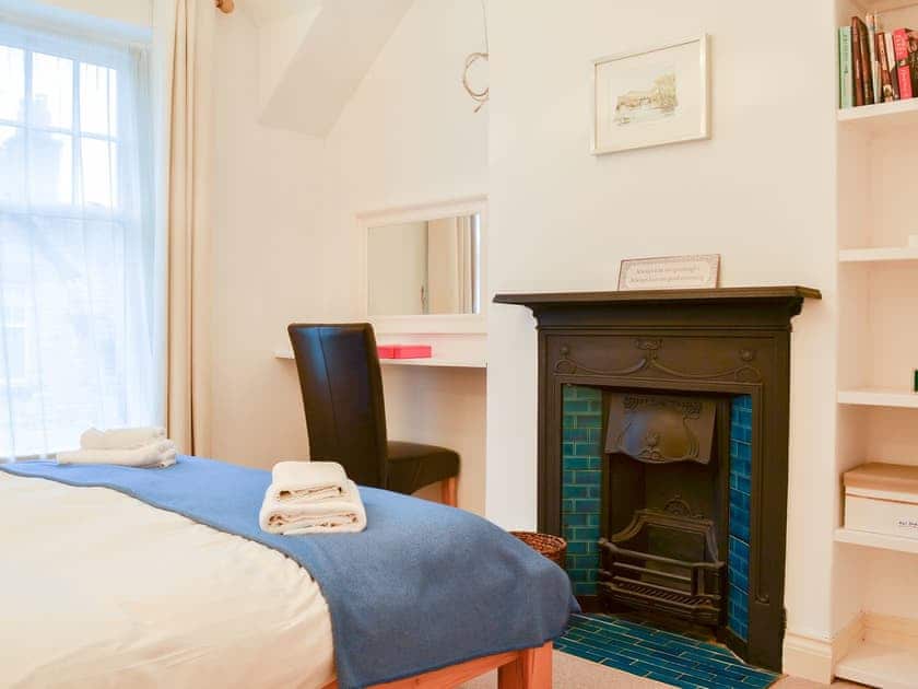 Bedrom with a feature open fireplace | Lythdene, Grange-over-Sands