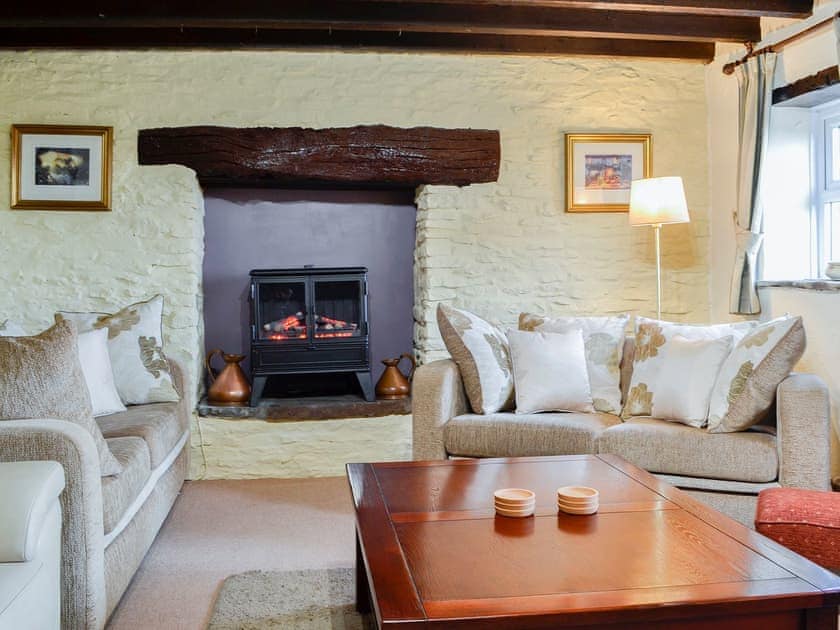 Lovely and cosy living room with feature fireplace | Penny Croft - The Crofters Cottages, Llangeinor, near Bridgend