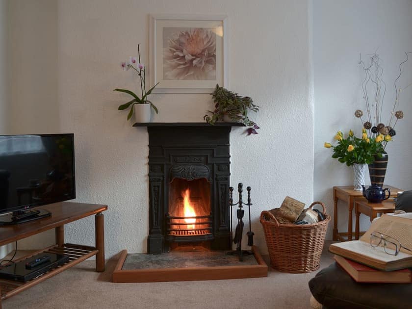 Living room with open fire | Bridgend Cottage, Lostwithiel