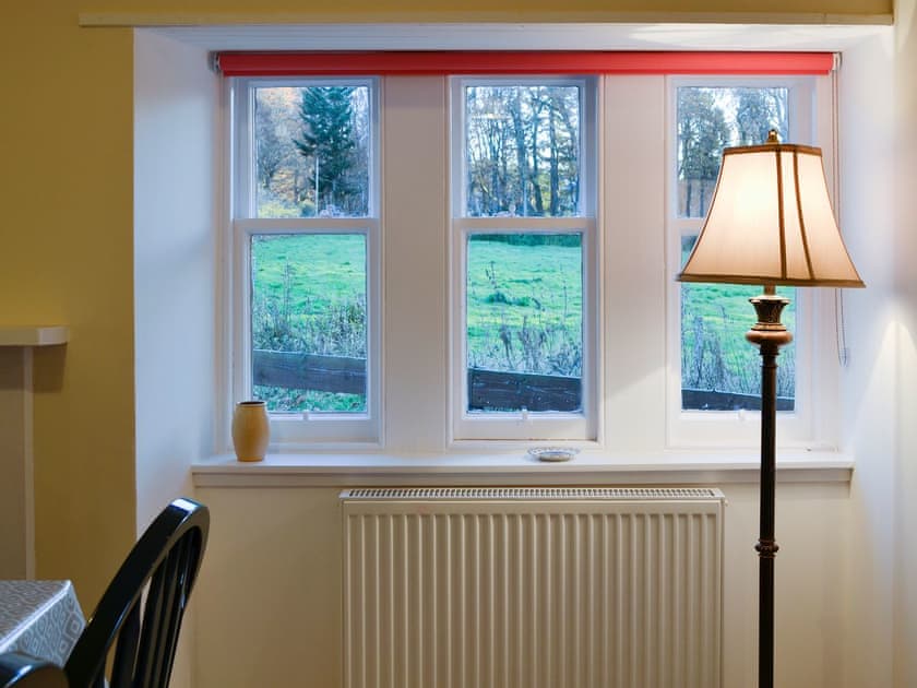 Wonderful garden views from the dining room | Dairy Cottage, Whitehouse, near Alford