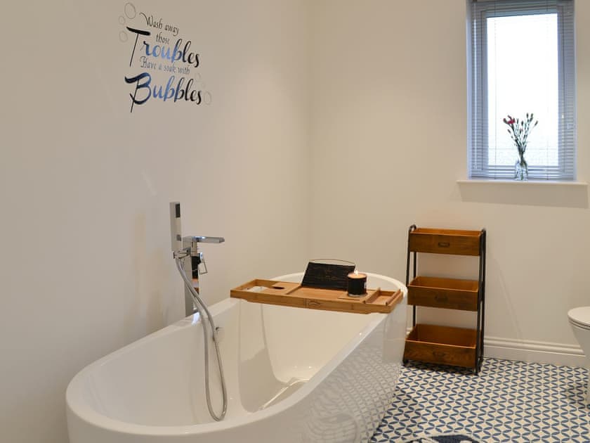 Bathroom with contemporary tub and shower attachment | West Kilbride, Near Lochboisdale
