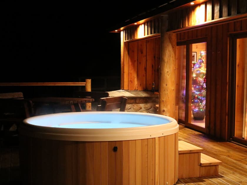 Relax in the lovely private hot tub | Osprey Lodge, Rogart, near Dornoch
