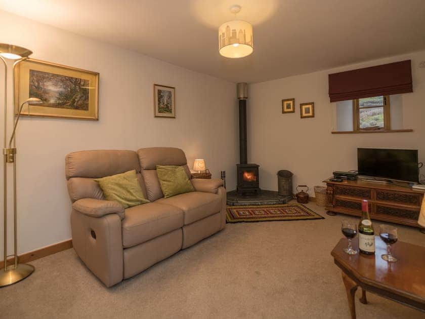 Sitting room with wood burner | Y Beudy, Pwllglas, near Ruthin