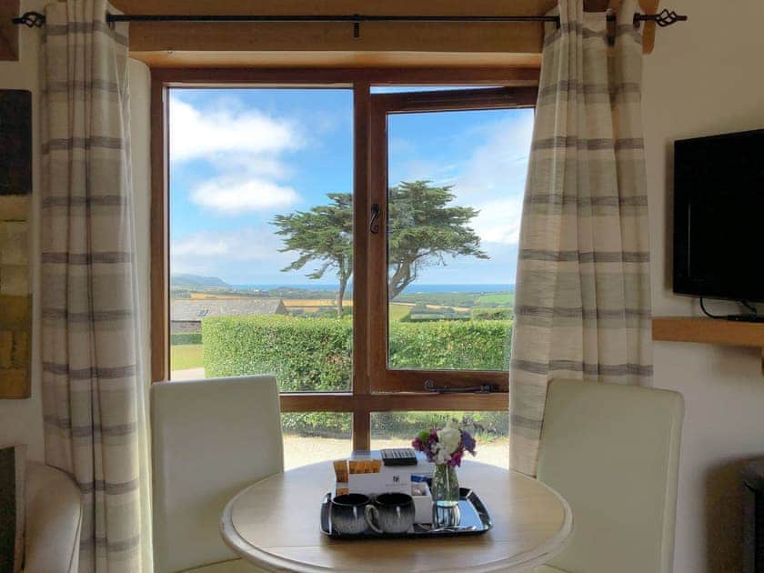 Wonderful far reaching sea views from the dining area | Wenna’s Well - Wooldown Holiday Cottages, Marhamchurch, near Bude