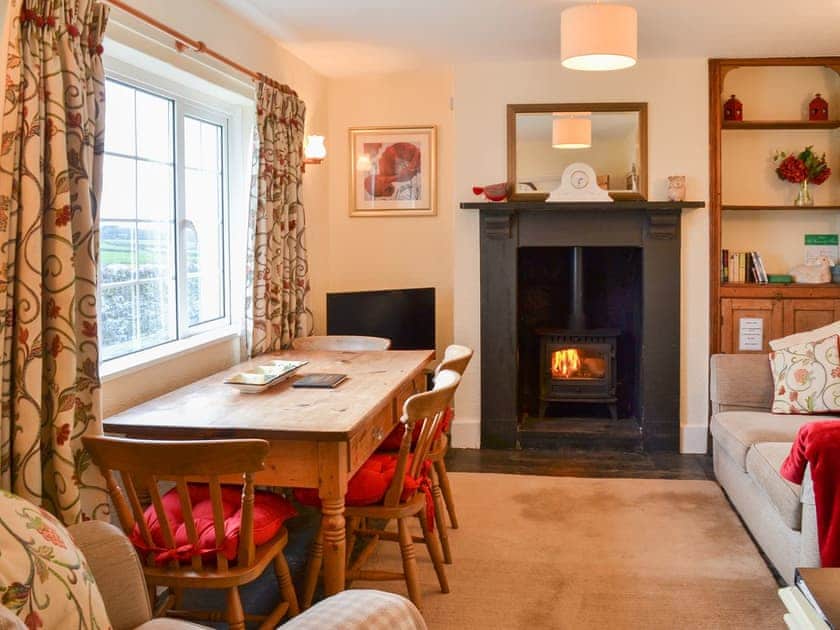 Cosy and comfortable living/dining room | St Cadoc Cottage, Harlyn Bay, near Padstow